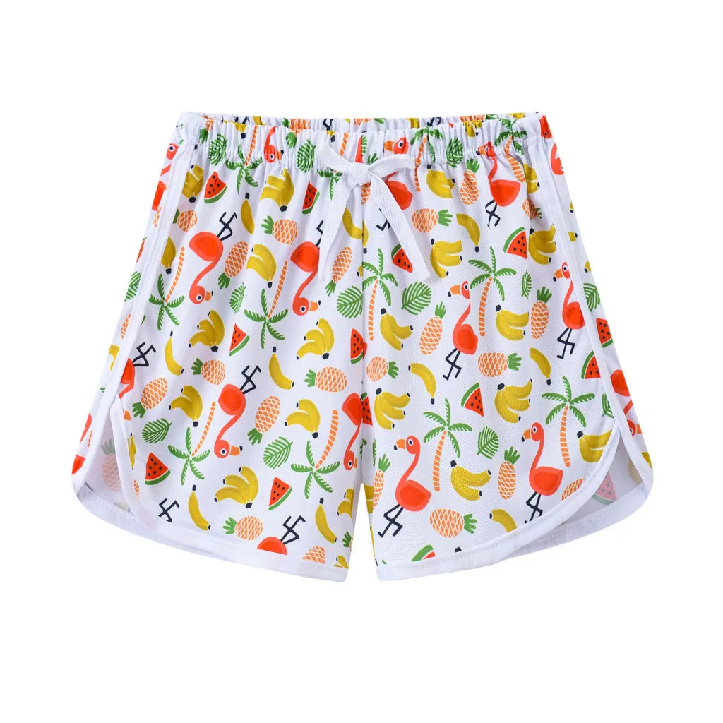 Children's colourful polyester shorts with elastic waistband, showing patterns like stripes, pineapples, and kittens.