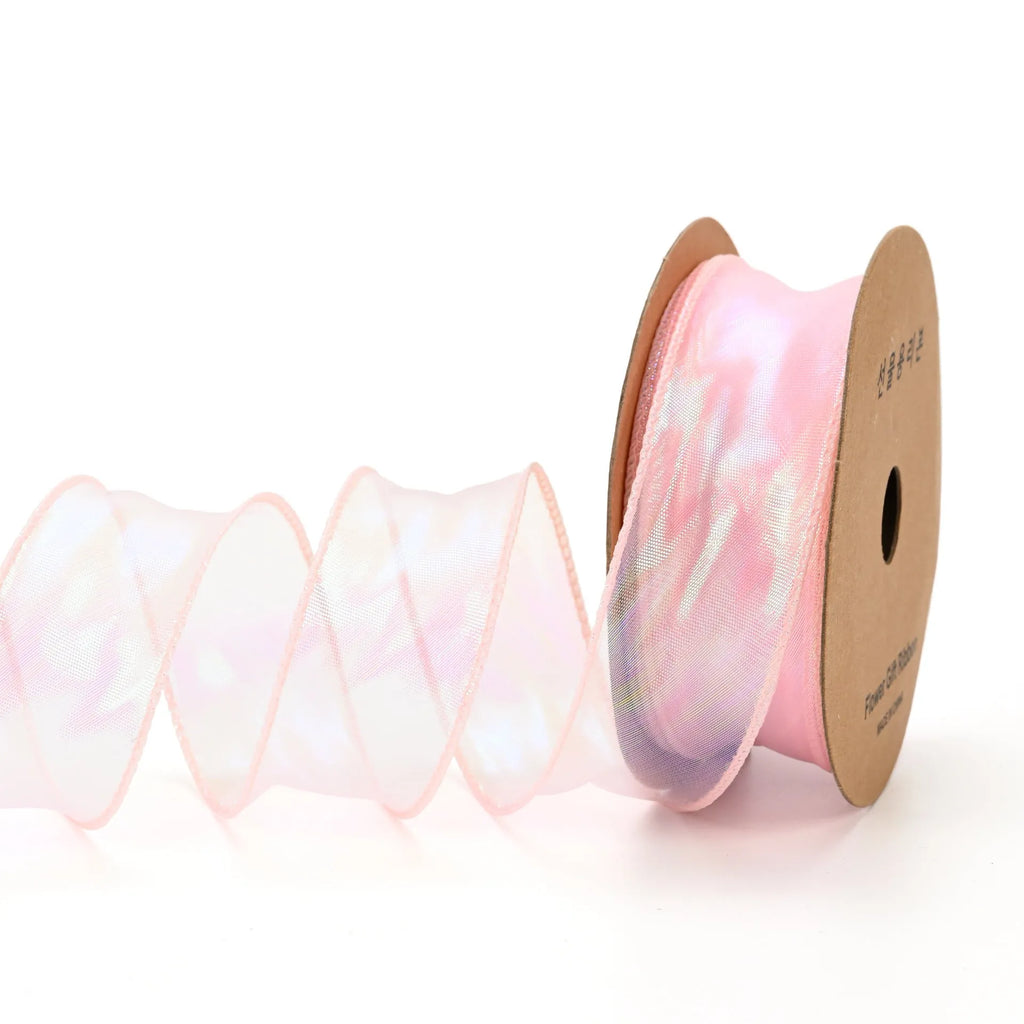 Roll of 4cm wide mesh fishtail yarn ribbon in colourful wave design for craft projects.