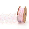 Roll of 4cm wide mesh fishtail yarn ribbon in colourful wave design for craft projects.