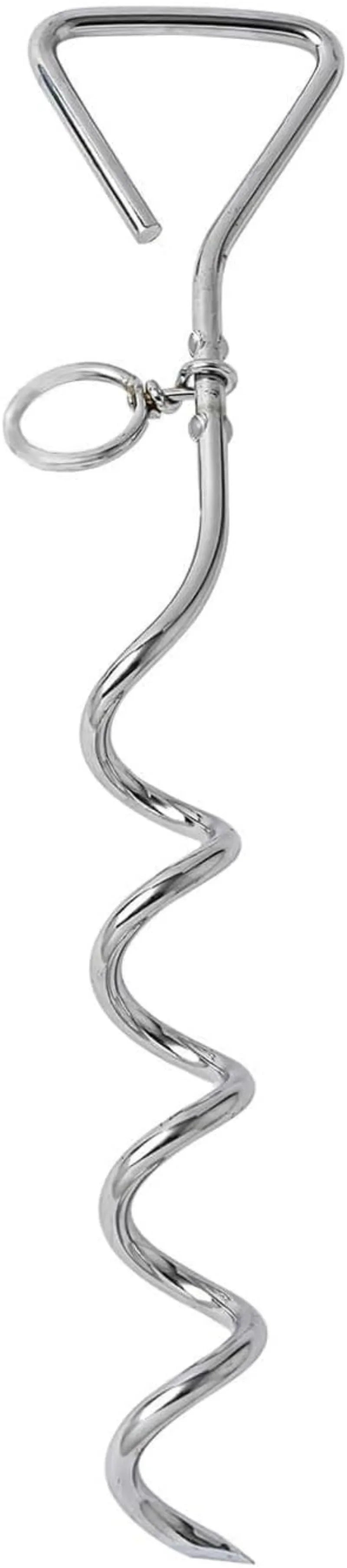 Silver spiral dog tie out stake made of steel, shown screwed into sandy ground with a leash attached.