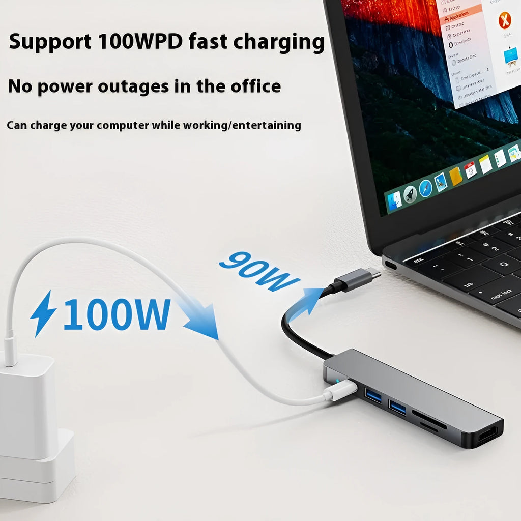 Portable silver 6-in-1 TYPE-C expansion dock with short attached cable for laptops and tablets.