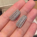 Geometric stud earrings with white gold colour finish and inlaid zircon stones