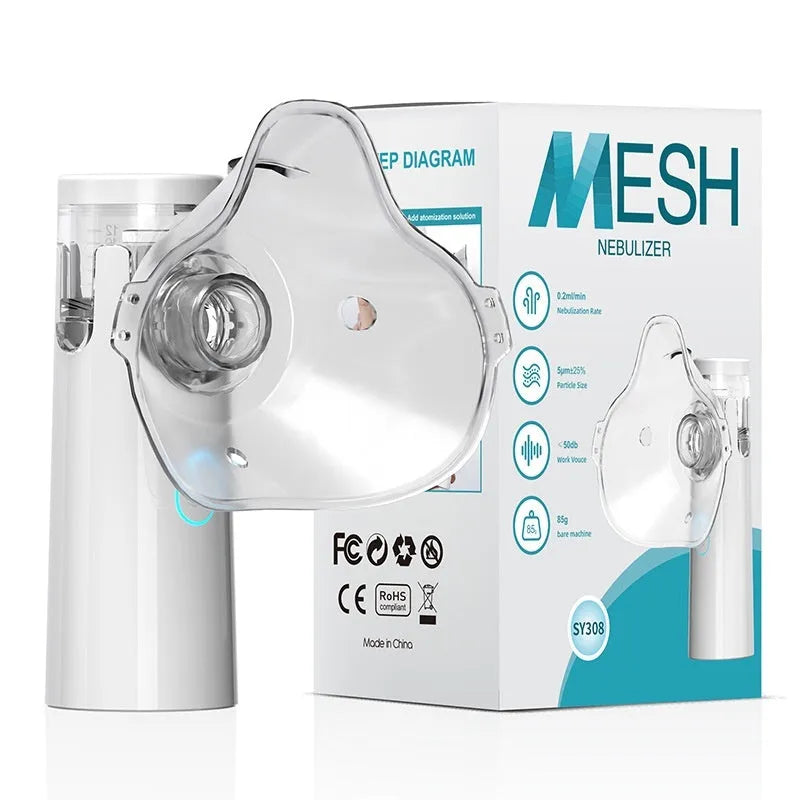 White neutral SY308 portable compressed micro-mesh nebulizer with bilateral masks and power cord on flat surface