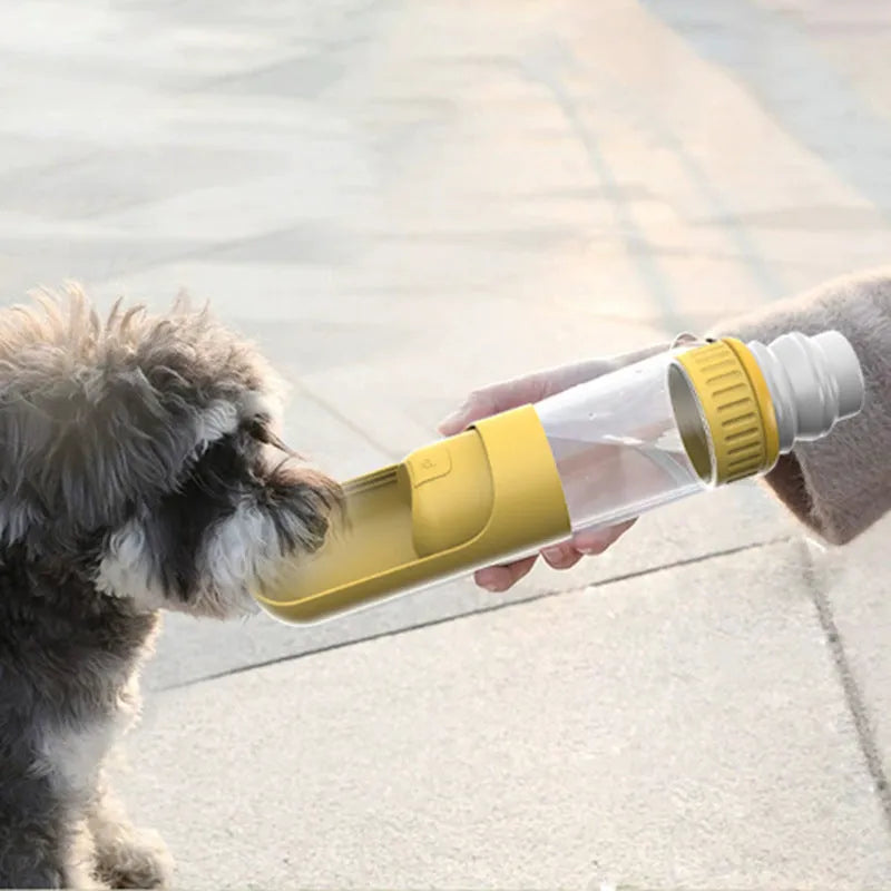 Portable blue dog water bottle with integrated drinking bowl for travel.