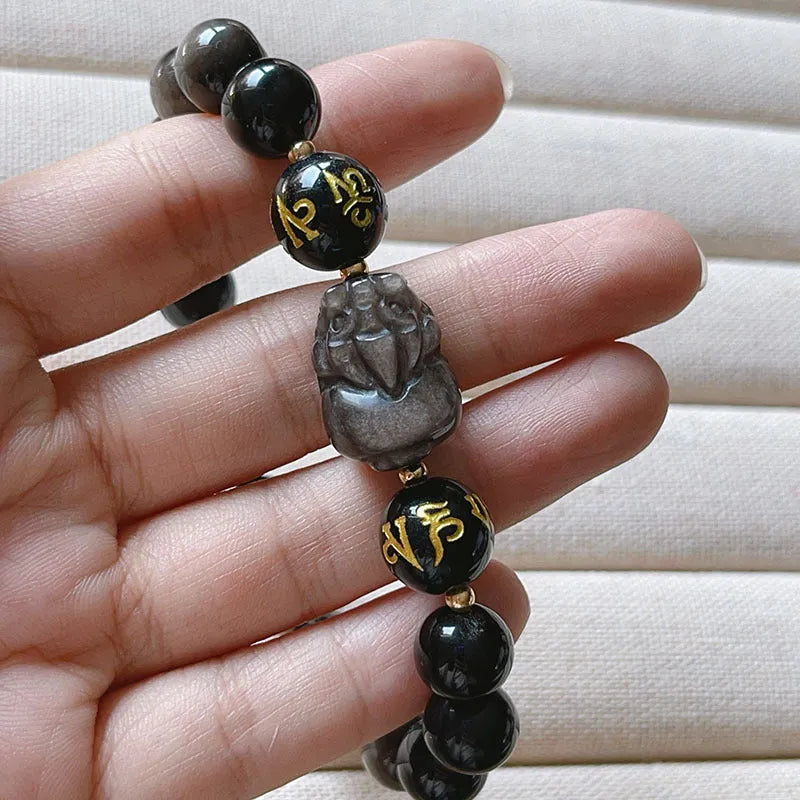 Men's silver stone beaded bracelet with Chinese style and engraved proverbs on a dark background.