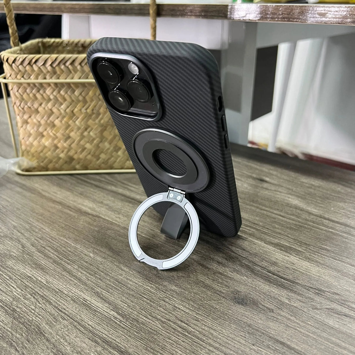 Portable magnetic wrist strap round silicone bracket phone holder in black on a wrist