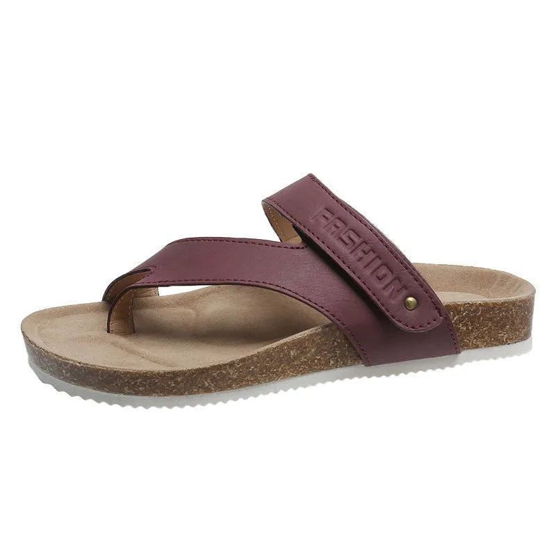 Women's blue flat toe ring thick-soled flip-flops on a solid background.