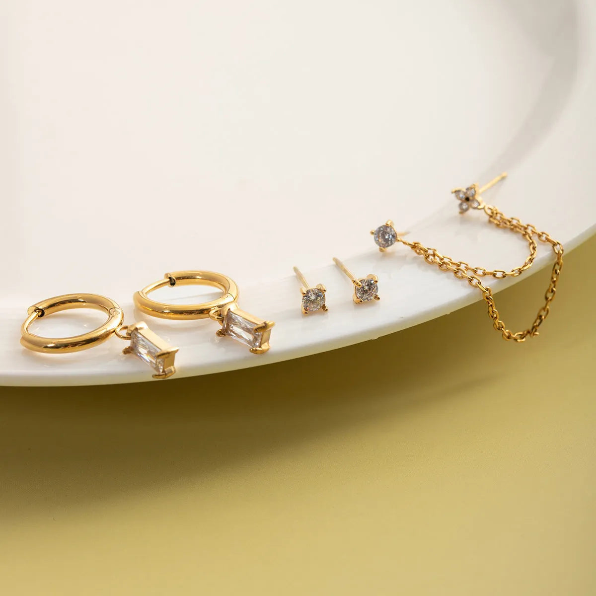 Set of five light luxury stainless steel geometric earrings with electroplated finish, colour JDE0307064, on display card