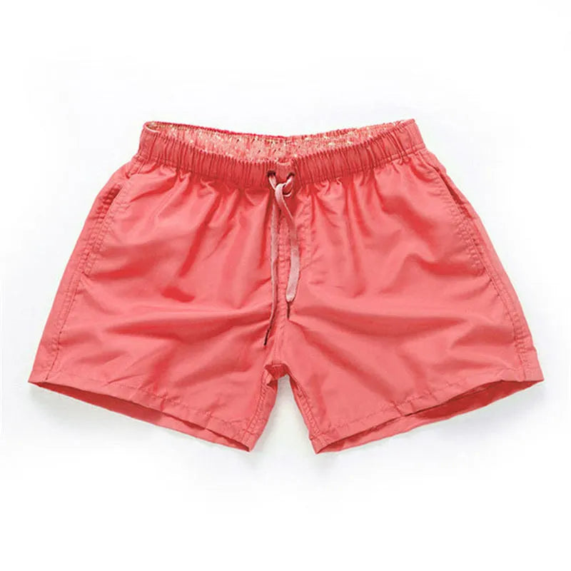Men's straight-leg polyester beach shorts in multiple colours on a size chart showing S to 4XL.