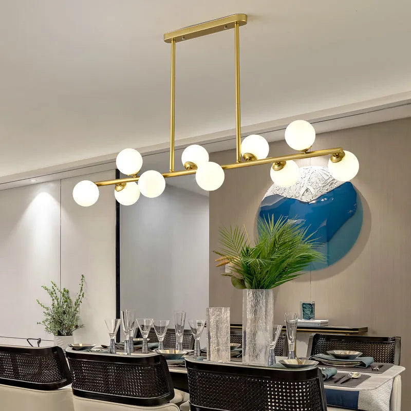 Glass bubble ball chandelier with black iron frame, clear glass shades, and multiple arms