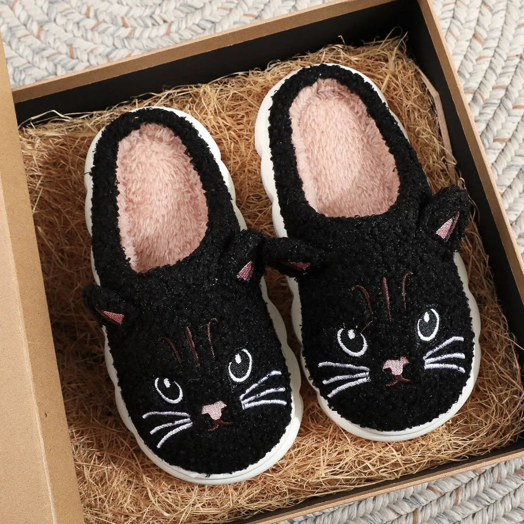 Winter cartoon cat fluffy slippers with plush upper and non-slip EVA sole, in black, white, pink, or grey.