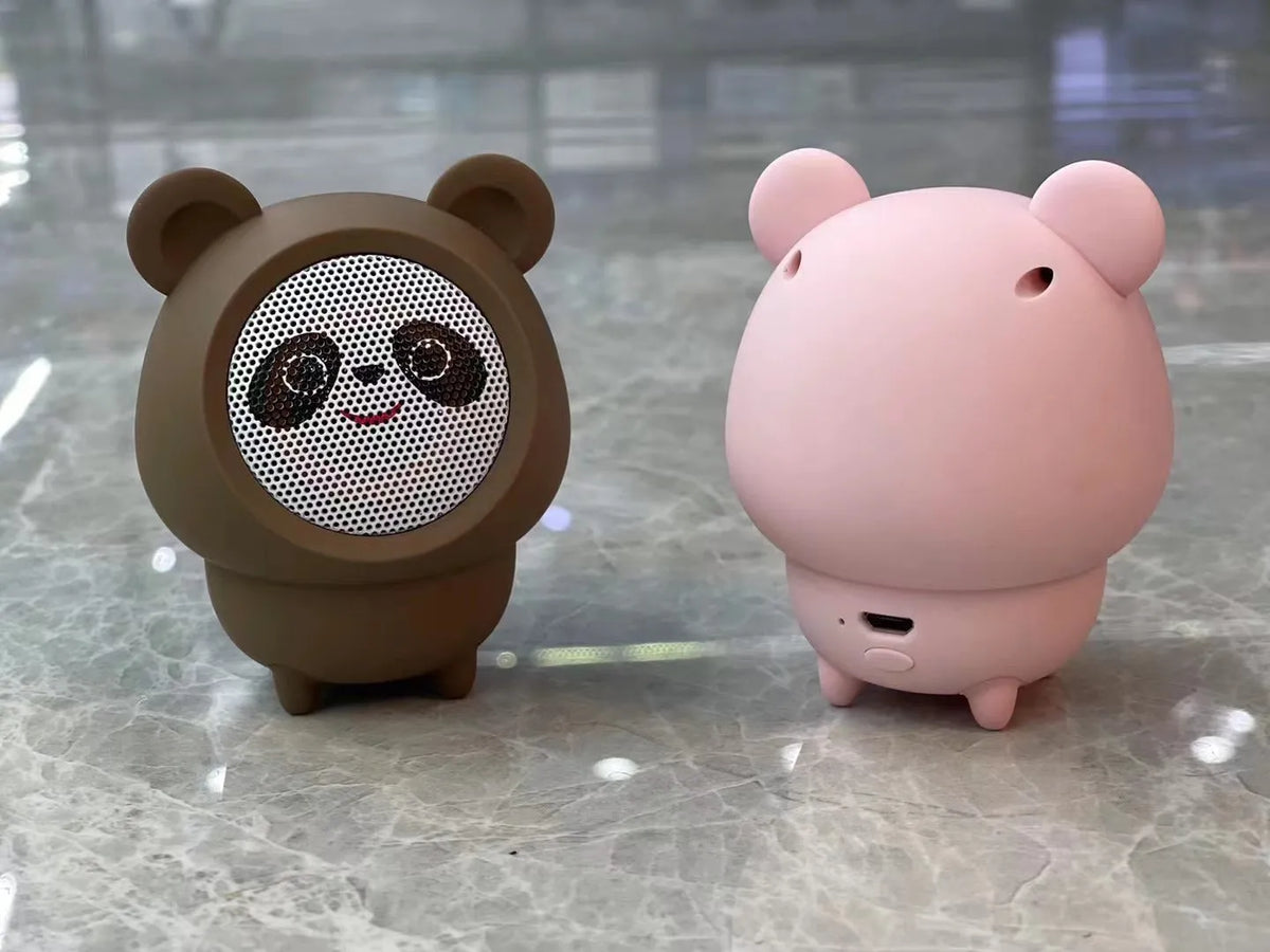 Cartoon panda desktop Bluetooth speaker in plastic, shown in one of five colours: white, pink, blue, black or brown.