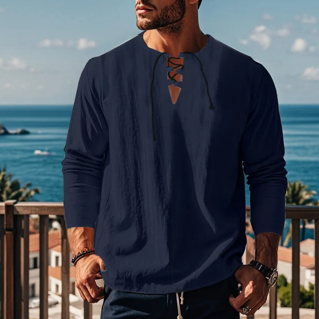 Cotton linen blend solid colour beach shirt in a loose pullover style on a hanger.