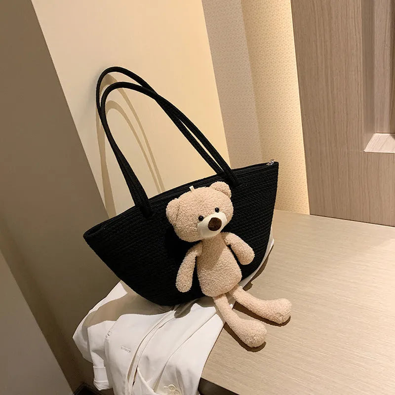 Woven cotton linen tote bag with dumpling shape, double shoulder straps, and an external pocket in one of six colours.