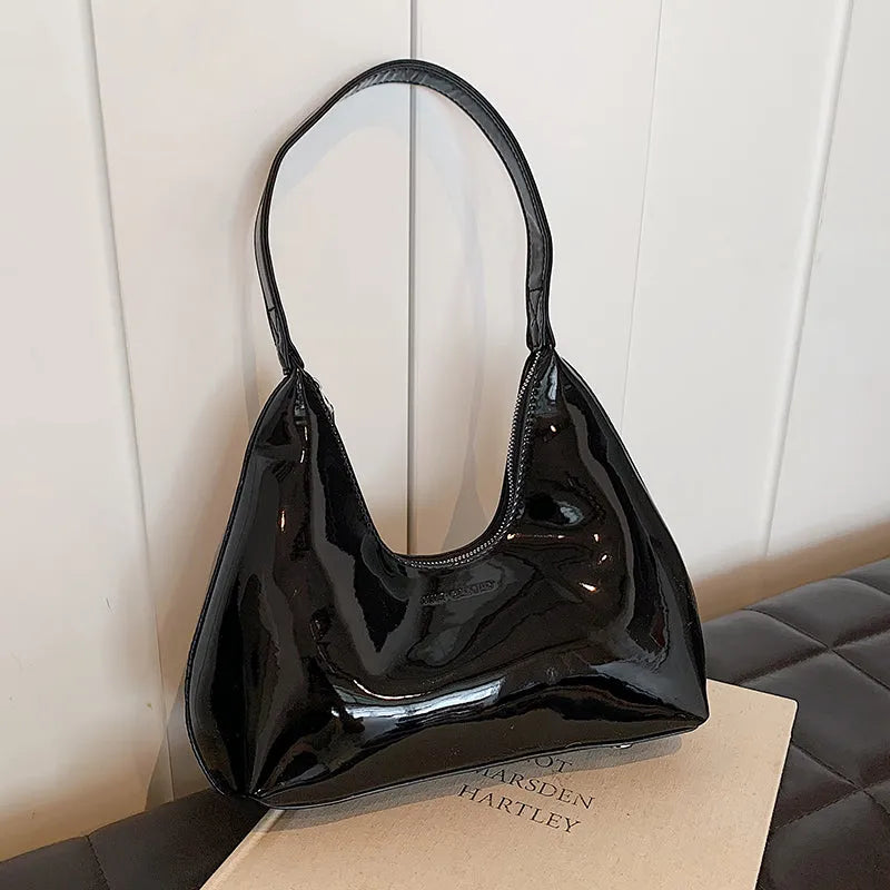 French style PU leather shoulder bag with sewing line detail and dumpling shape, available in multiple colours