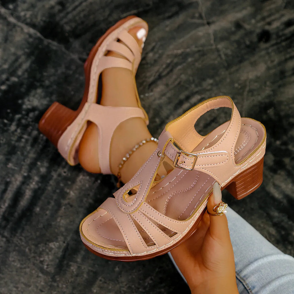 Women's black peep toe wedge platform sandals showing buckle fastening and fish mouth toe design.