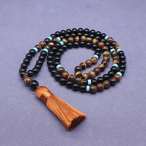 Geometric beaded jewellery set with black agate and tiger's eye stones showing bracelet and necklace options
