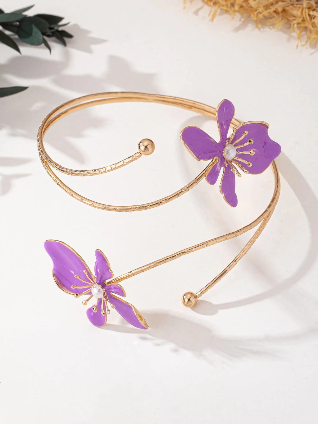 Pink and purple alloy armband with hollow linear pattern design and adjustable fit