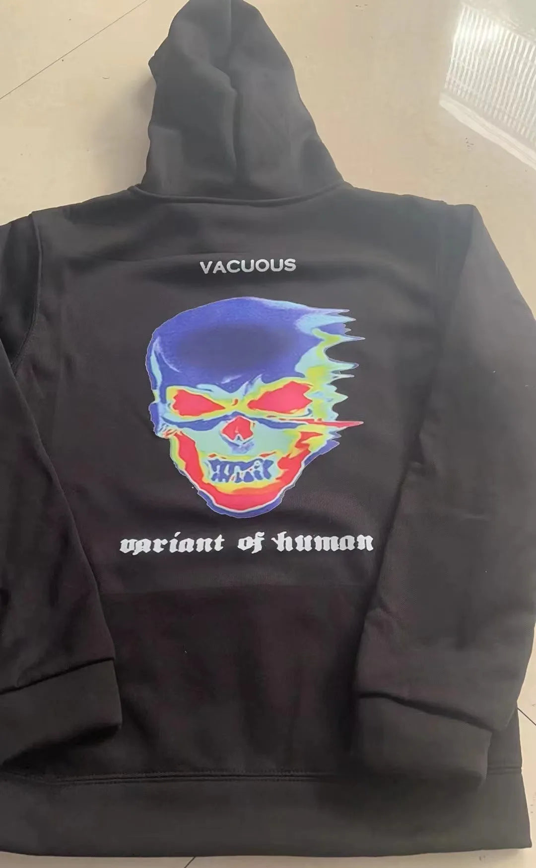 Skeleton thermal imaging graphic print hoodie, long sleeve pullover with hood and side seam pockets, 85% polyester.