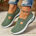 Women's low-top mesh casual flats with a T-strap in various colours on a soft PVC sole.