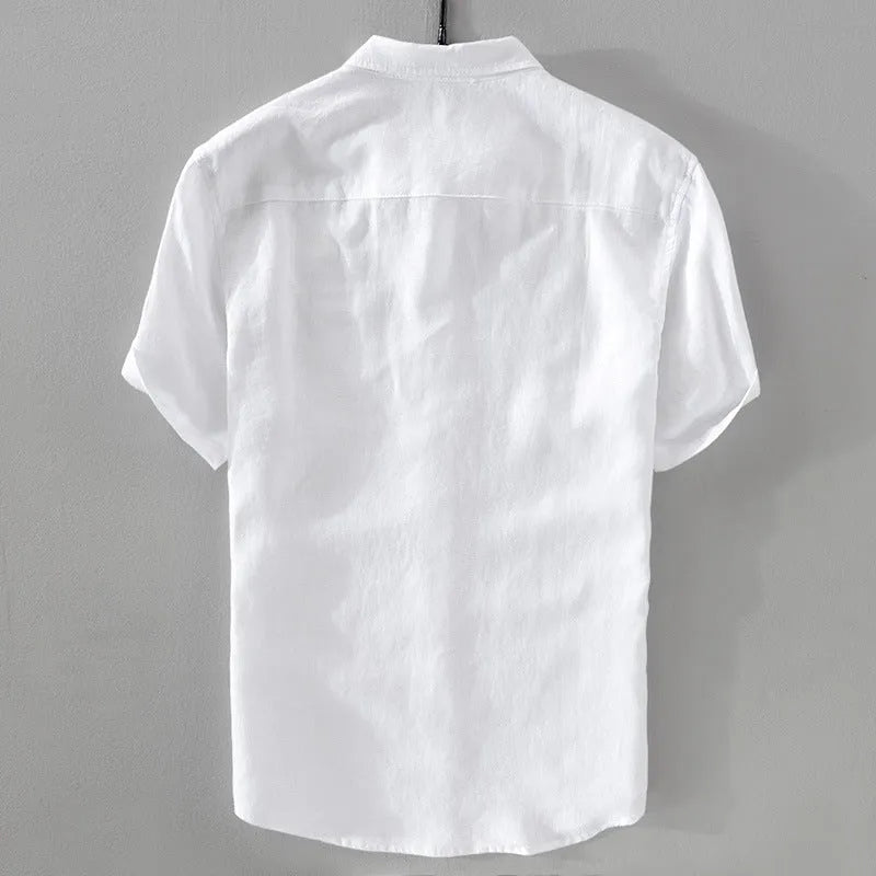 Man wearing a short sleeve apricot coloured loose-fit linen blend casual shirt.