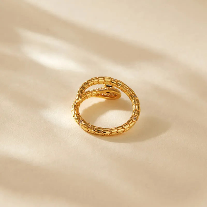 Adjustable snake finger ring for women in gold colour with diamond treatment on copper