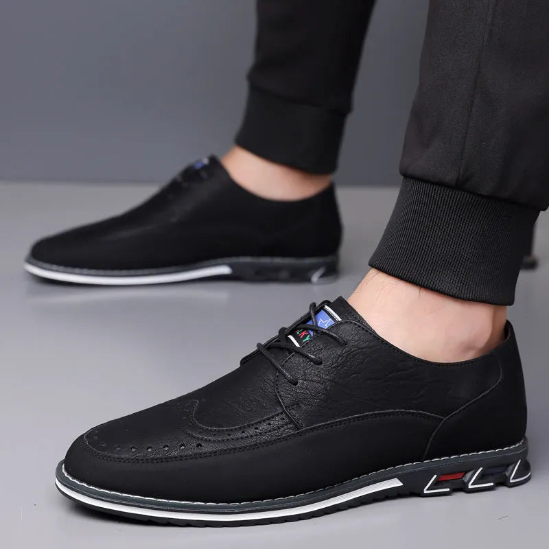 Men's black leather casual shoes with a low top, rubber sole, decorative stitching, and a leather toe cap.