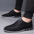 Men's black leather casual shoes with a low top, rubber sole, decorative stitching, and a leather toe cap.