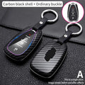 Simple car carbon fiber key cover in black with silicone interior and key chain