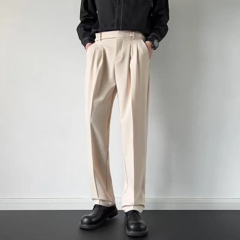 Men's apricot and black loose straight-leg suit trousers on hanger with size tags