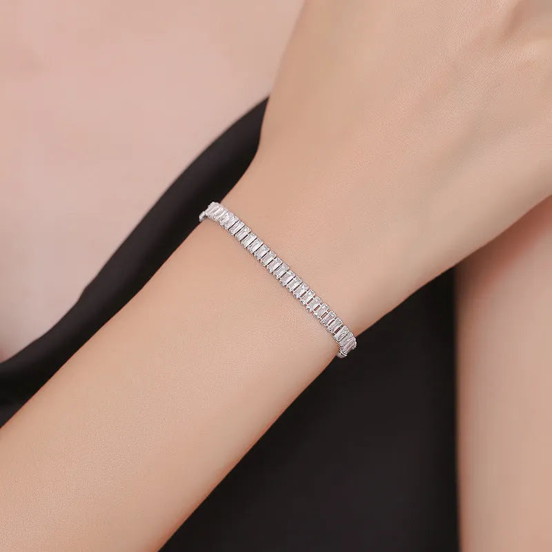 Women's geometric brass bracelet with full diamond zircon look in quadrilateral design