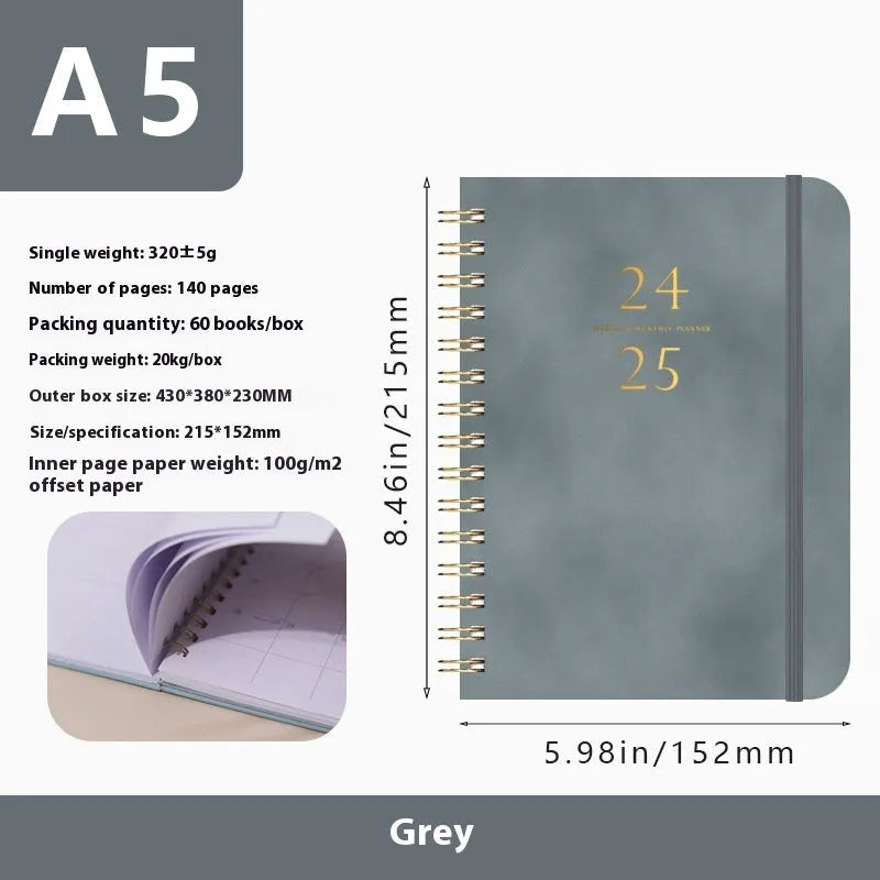 A5 leather notebook with metal coil binding in various colours including black, blue, and green.