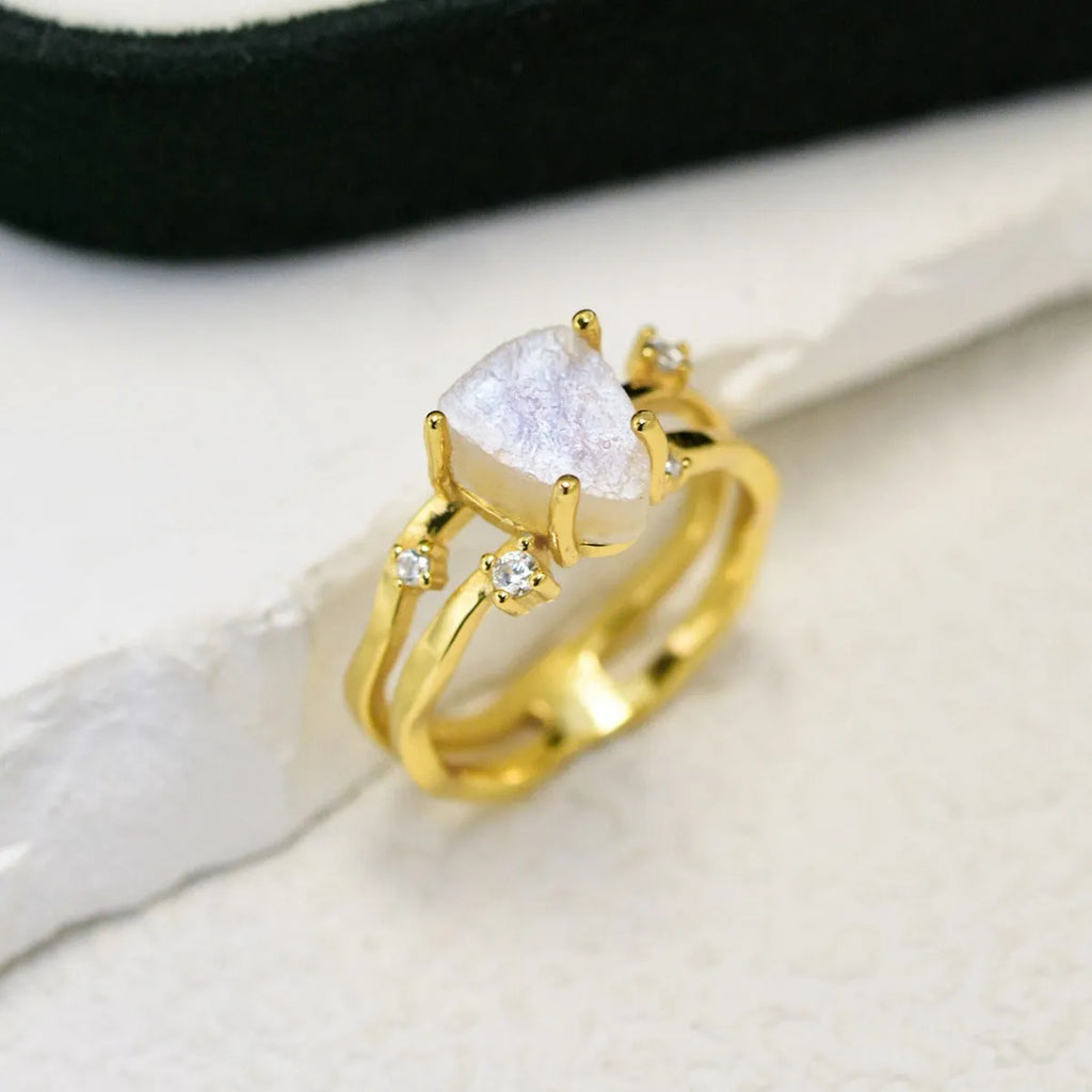 S925 silver geometric ring featuring an irregular triangle design with a moonstone, shown in rose gold, white gold, and yellow gold finishes.
