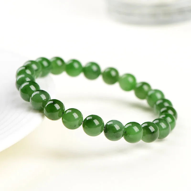 Natural Jasper bead bracelet on Hetian jade string showing polished stones in various sizes.