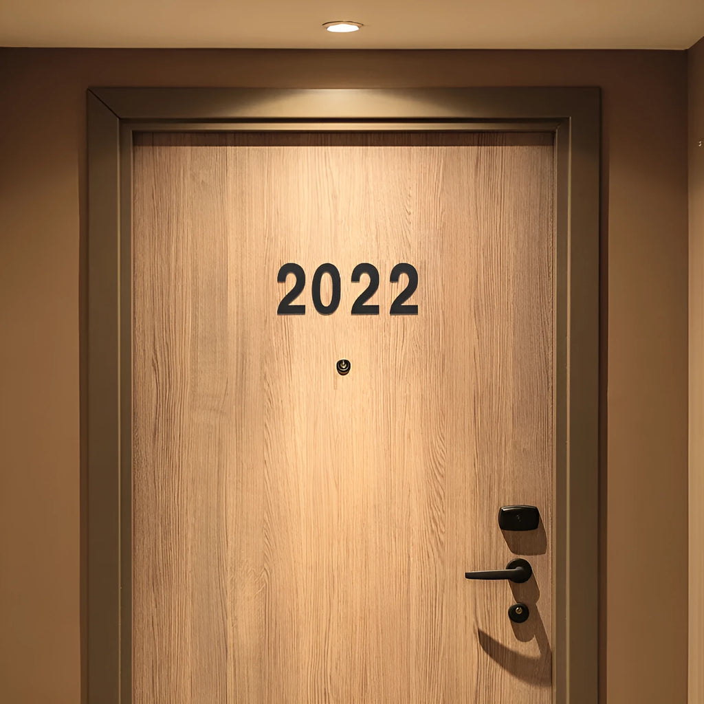 Black stainless steel self-adhesive house number sign with sticky backing, 7.5cm high.