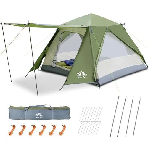 Dark green instant pop-up camping tent pitched outdoors, showing its automatic frame structure and two-person size.