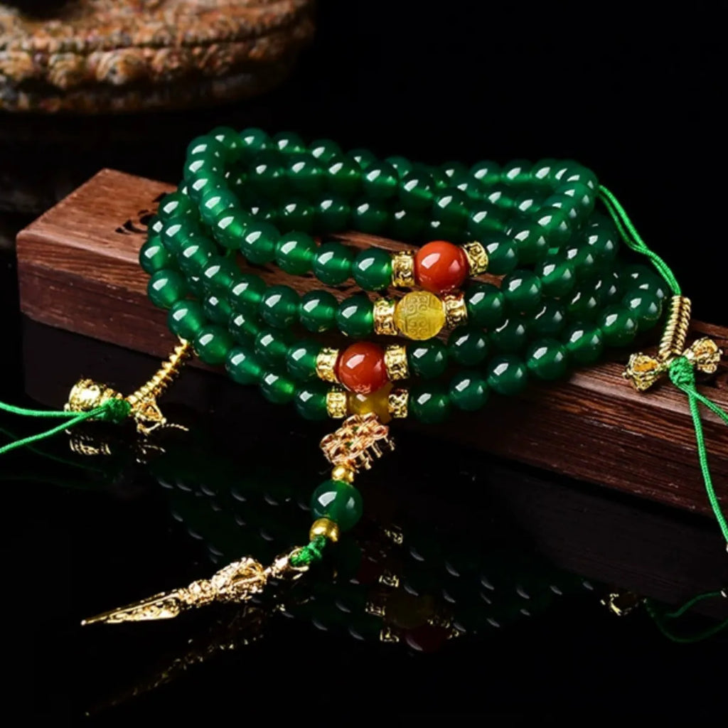 Handmade multi-strand green agate bracelet from Brazil on a wrist, showing stone sizes 6mm, 8mm, and 10mm.
