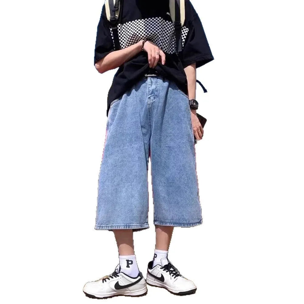 Blue men's cropped high-waisted denim-style shorts with a zipper fly on a white background.