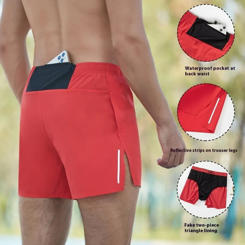 Men's red high-waist off-road running shorts with loose leg design, shown on a model running on a trail.