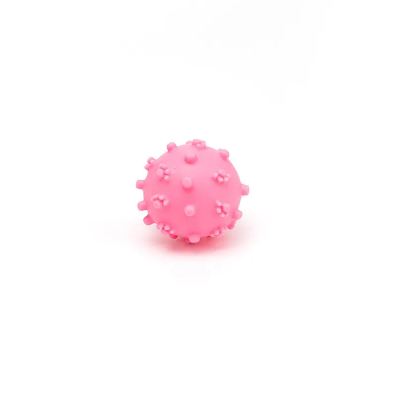 Four bright spiked squeaky dog balls in blue, green, pink, and yellow for small breed puppies.