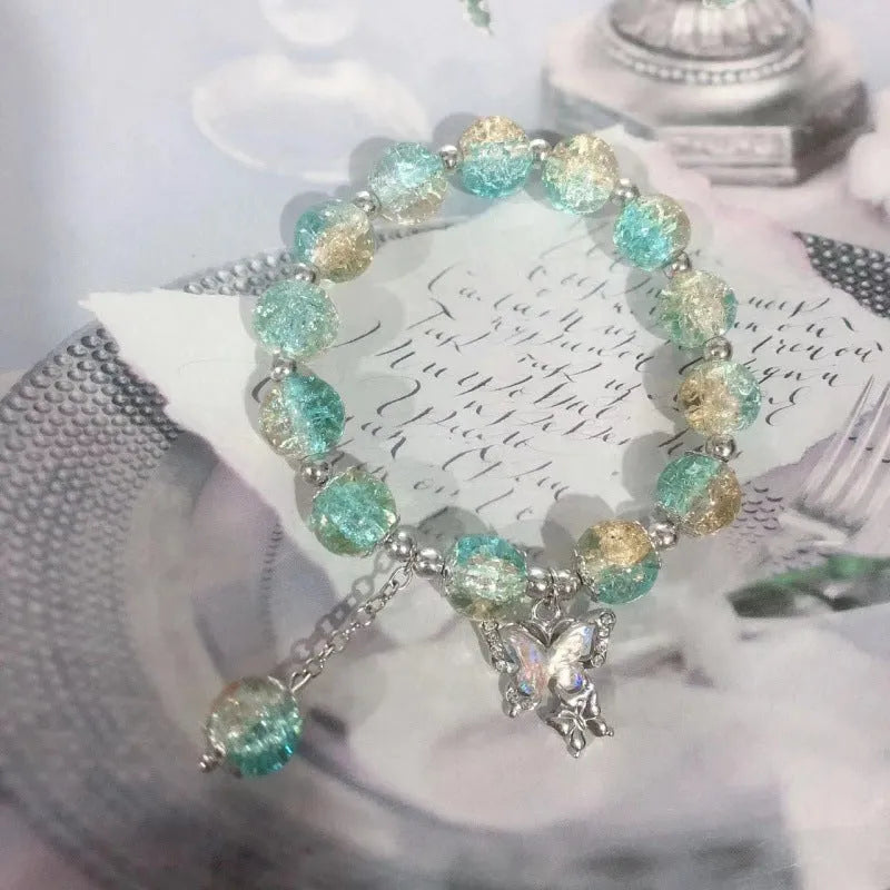Chinese style glass bead bracelet with bamboo leaf design and manual craftsmanship details.