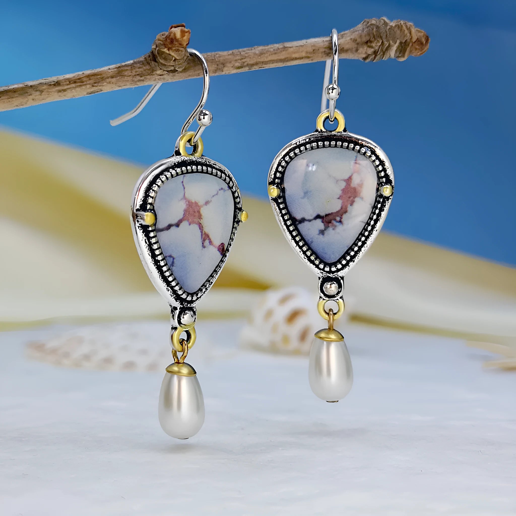 Retro blue Bohemian drop earrings with synthetic opal and pearl details on metal geometric setting