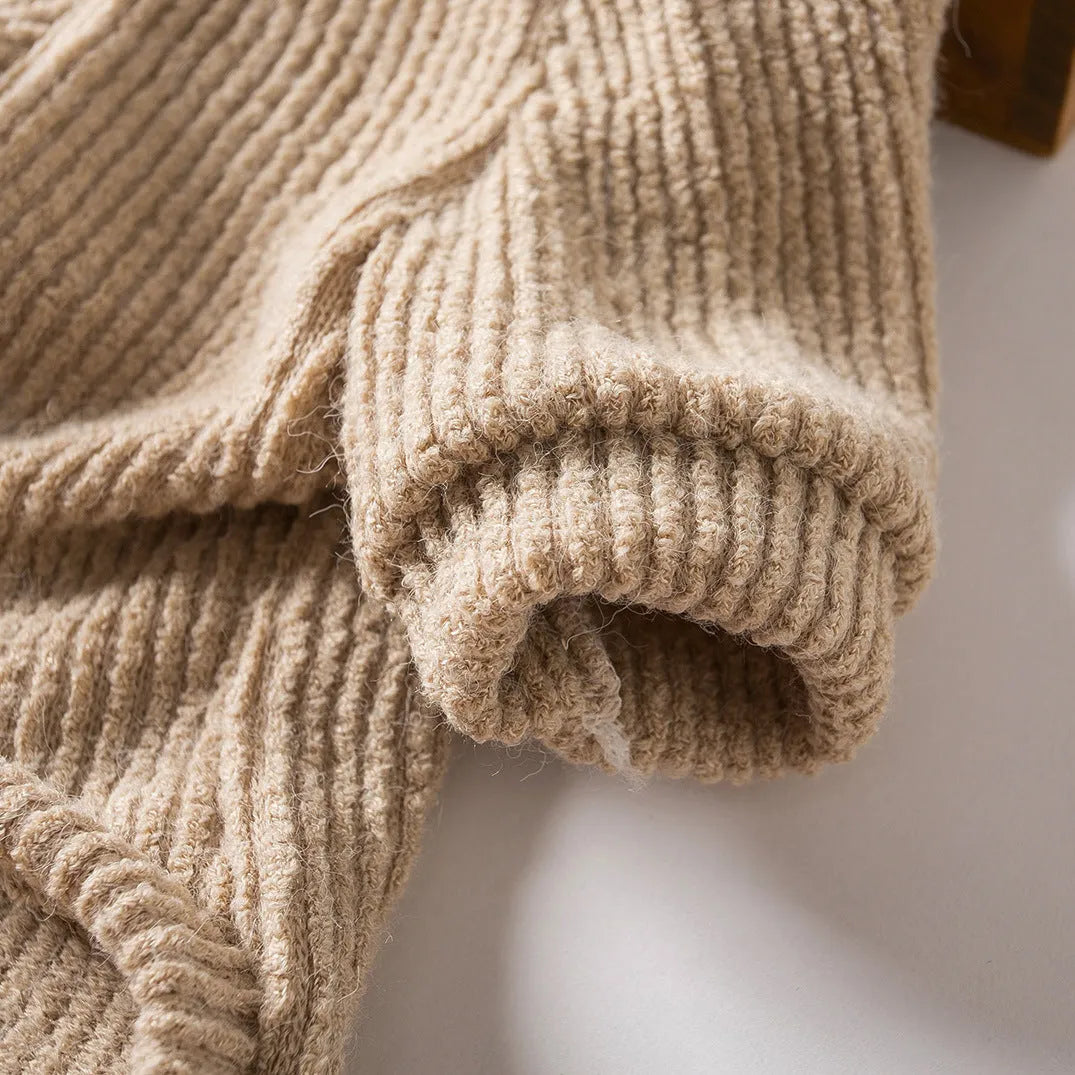 A brown cloth pullover sweater for a small dog on a white background.