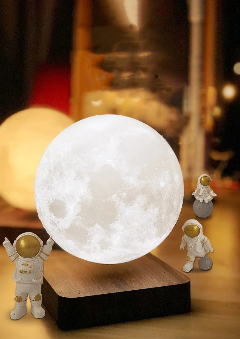 Moon Earth Maglev atmosphere night light with floating planets and astronaut figures on a shelf.