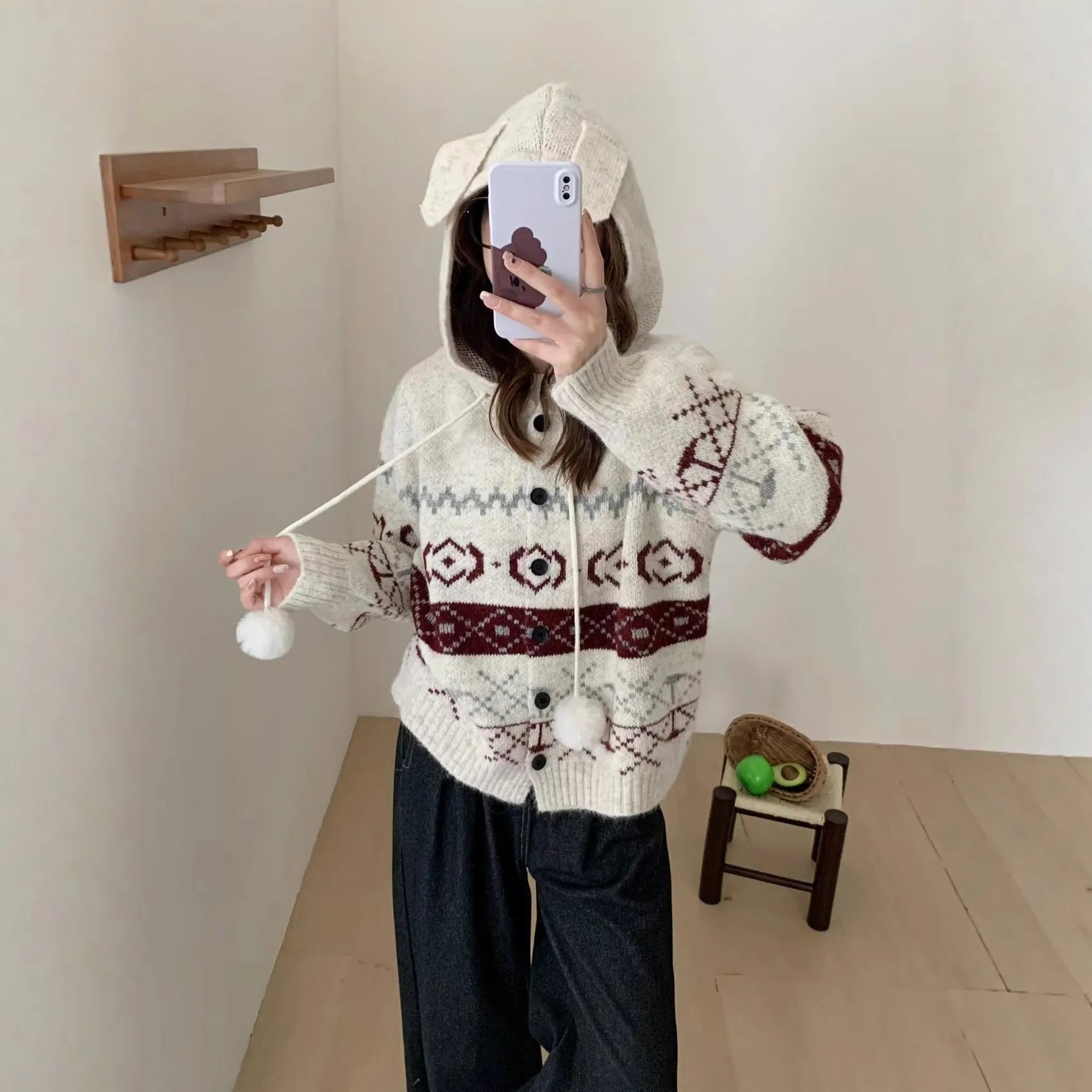 Plus size loose grey acrylic sweater coat with white geometric brocade pattern.