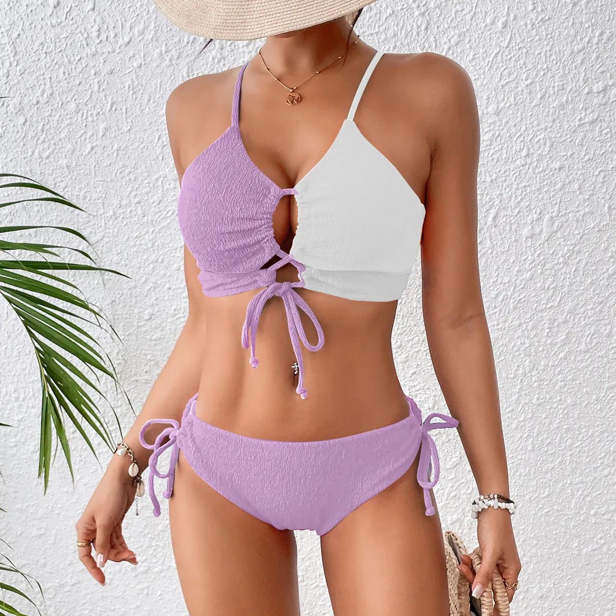 Women's black and white contrast colour cross sling hollow bikini set in polyester, front view