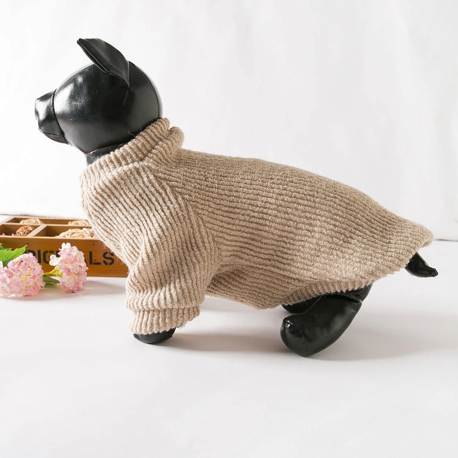 A brown cloth pullover sweater for a small dog on a white background.
