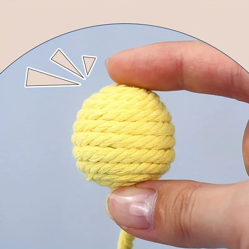 Colourful cat toy ball with attached rope and internal bell in green, pink, purple, and yellow options