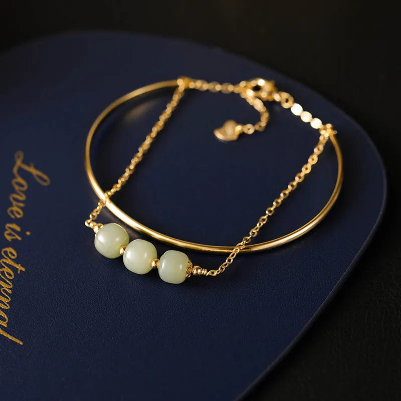 Hetian jade women's bracelet with gold inlay, showing lucky bead design in single, double, and three bead styles.