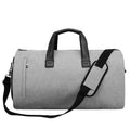 Medium oval travel bag in light grey with internal organiser pouches and a soft handle.